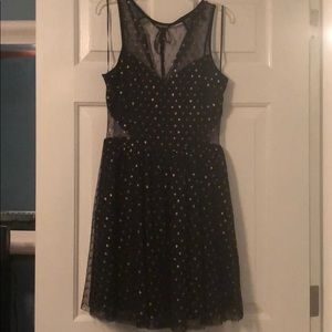 Black dress with gold polka dots and mesh detail